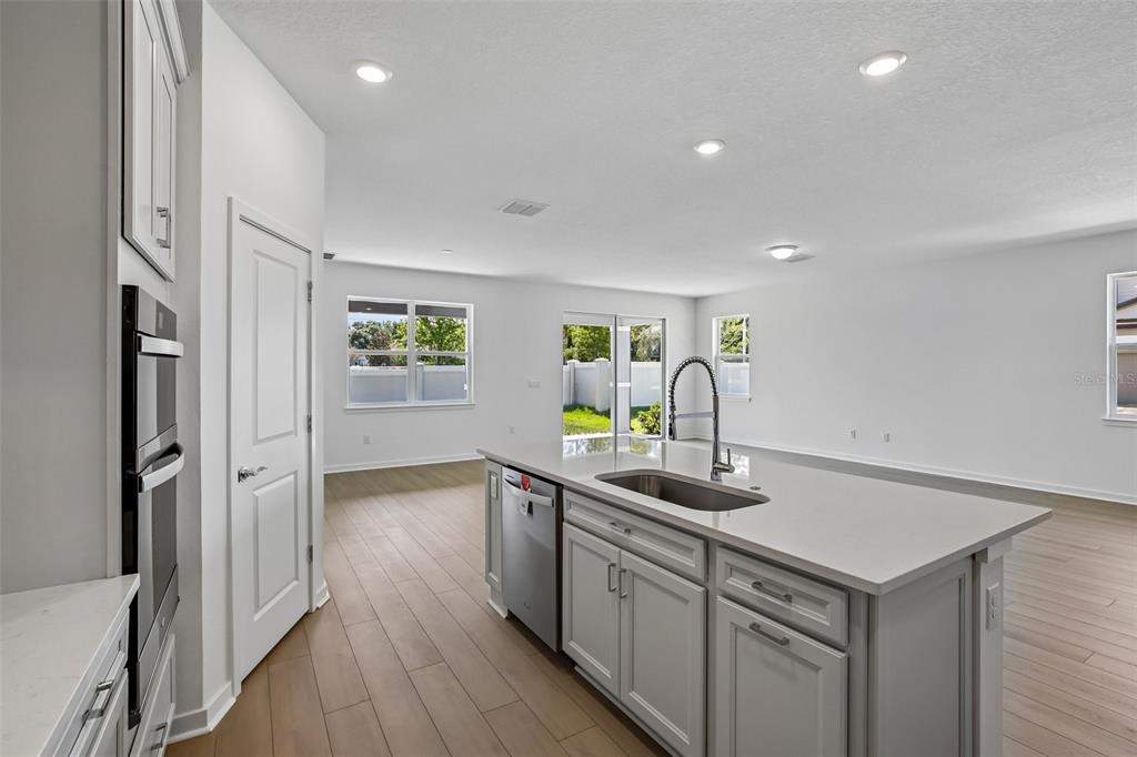 9932 Redwood Rdg Avenue Riverview, FL 33578 - Photo 6 of 38 a kitchen with cabinets and window