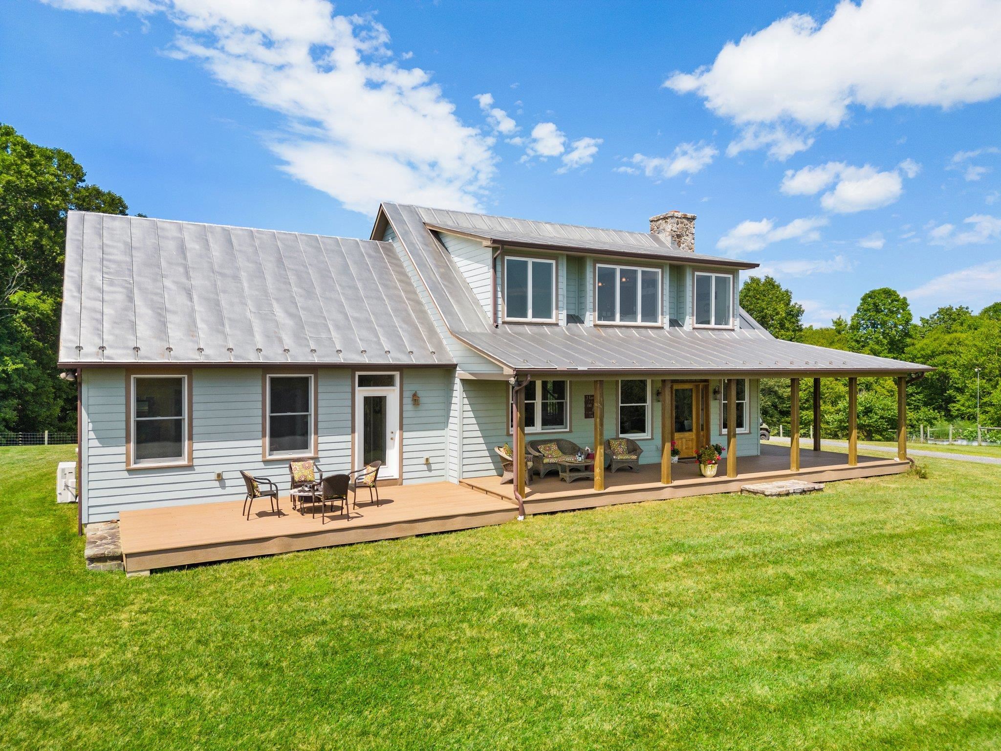 5237 Doe Hill Road McDowell, VA 24458 - Photo 11 of 75 a front view of a house with garden and patio