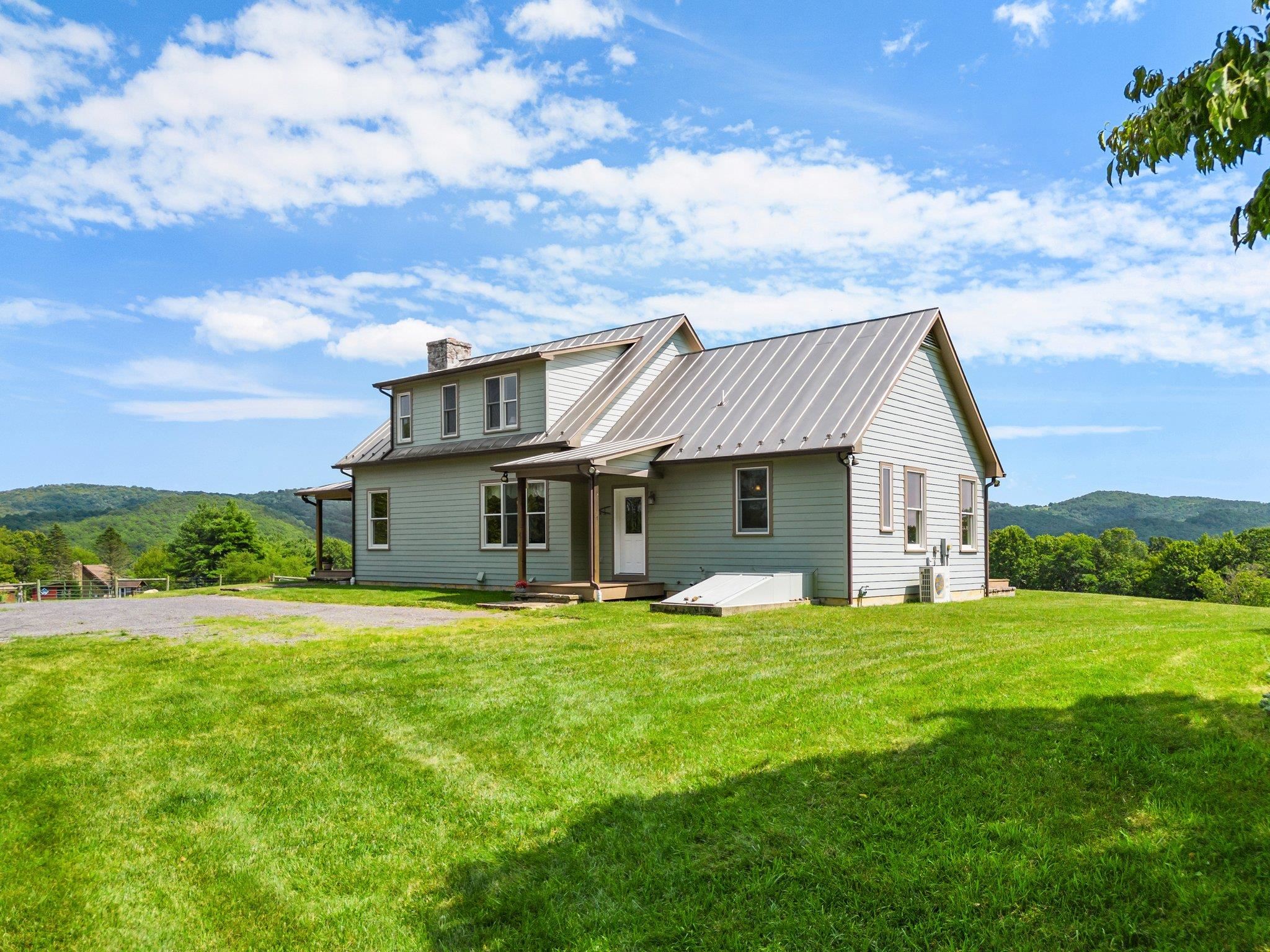 5237 Doe Hill Road McDowell, VA 24458 - Photo 12 of 75 a view of a house with a big yard and potted plants