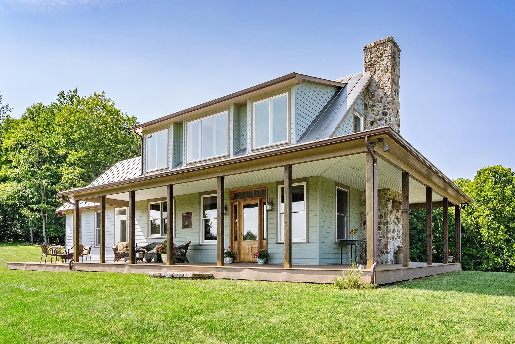 5237 Doe Hill Road McDowell, VA 24458 - Photo 13 of 75 a front view of a house with a yard table and chairs