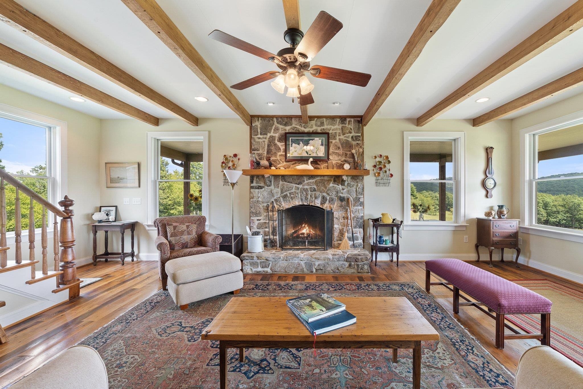 5237 Doe Hill Road McDowell, VA 24458 - Photo 29 of 75 a living room with furniture a fireplace and a large window