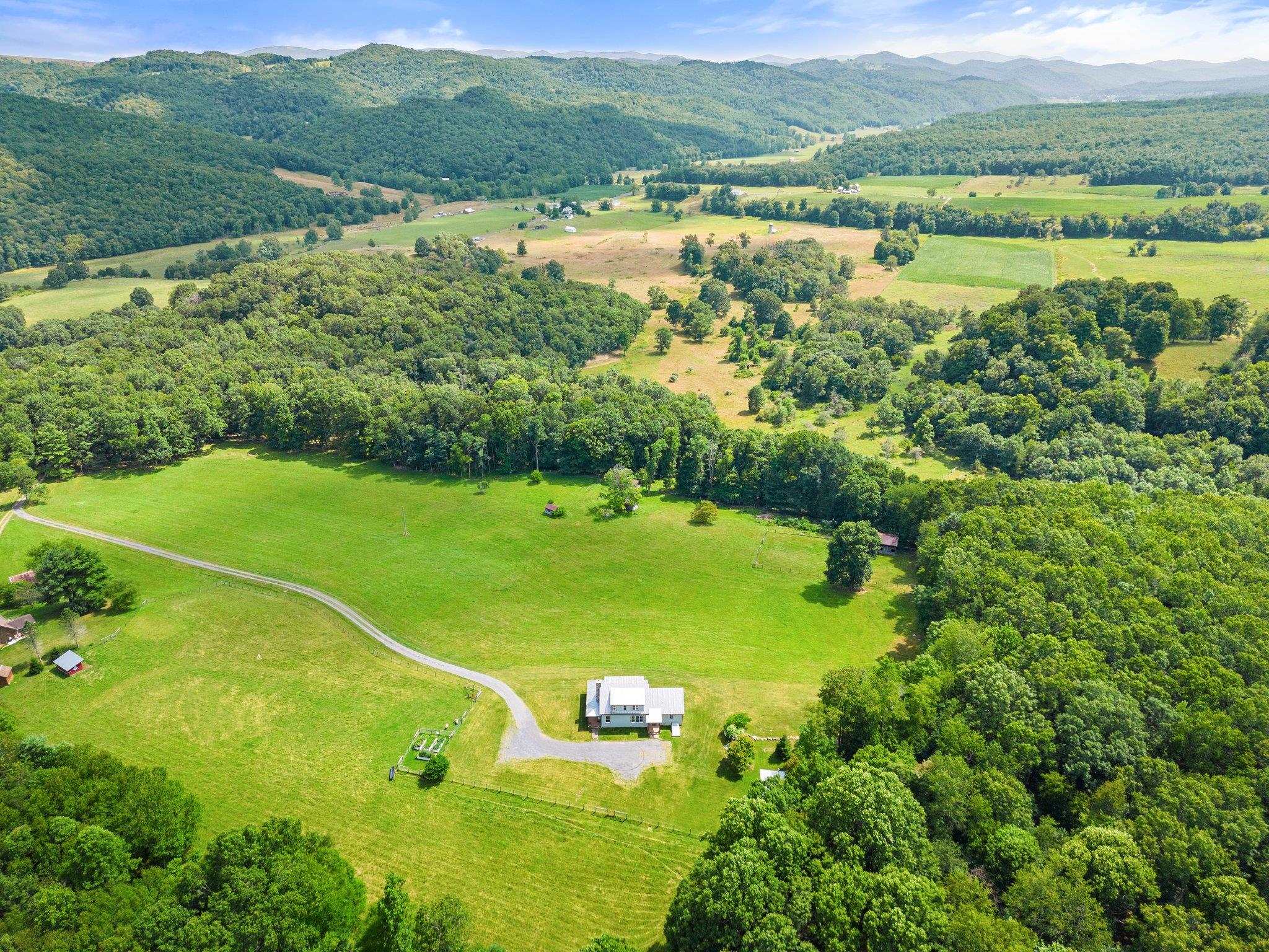 5237 Doe Hill Road McDowell, VA 24458 - Photo 3 of 75 a view of a lake with a mountain