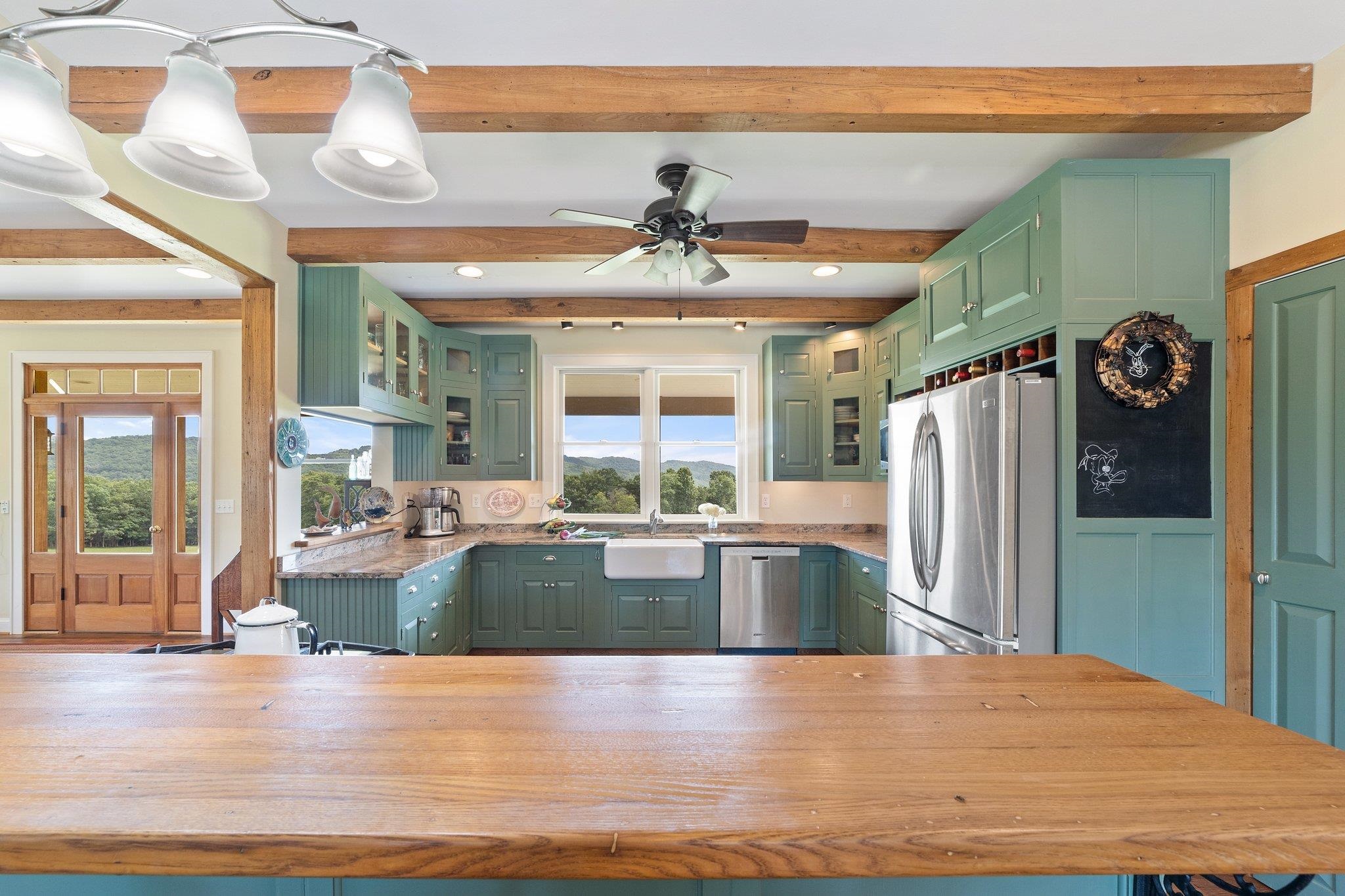 5237 Doe Hill Road McDowell, VA 24458 - Photo 35 of 75 a kitchen with stainless steel appliances granite countertop a refrigerator a sink and a stove