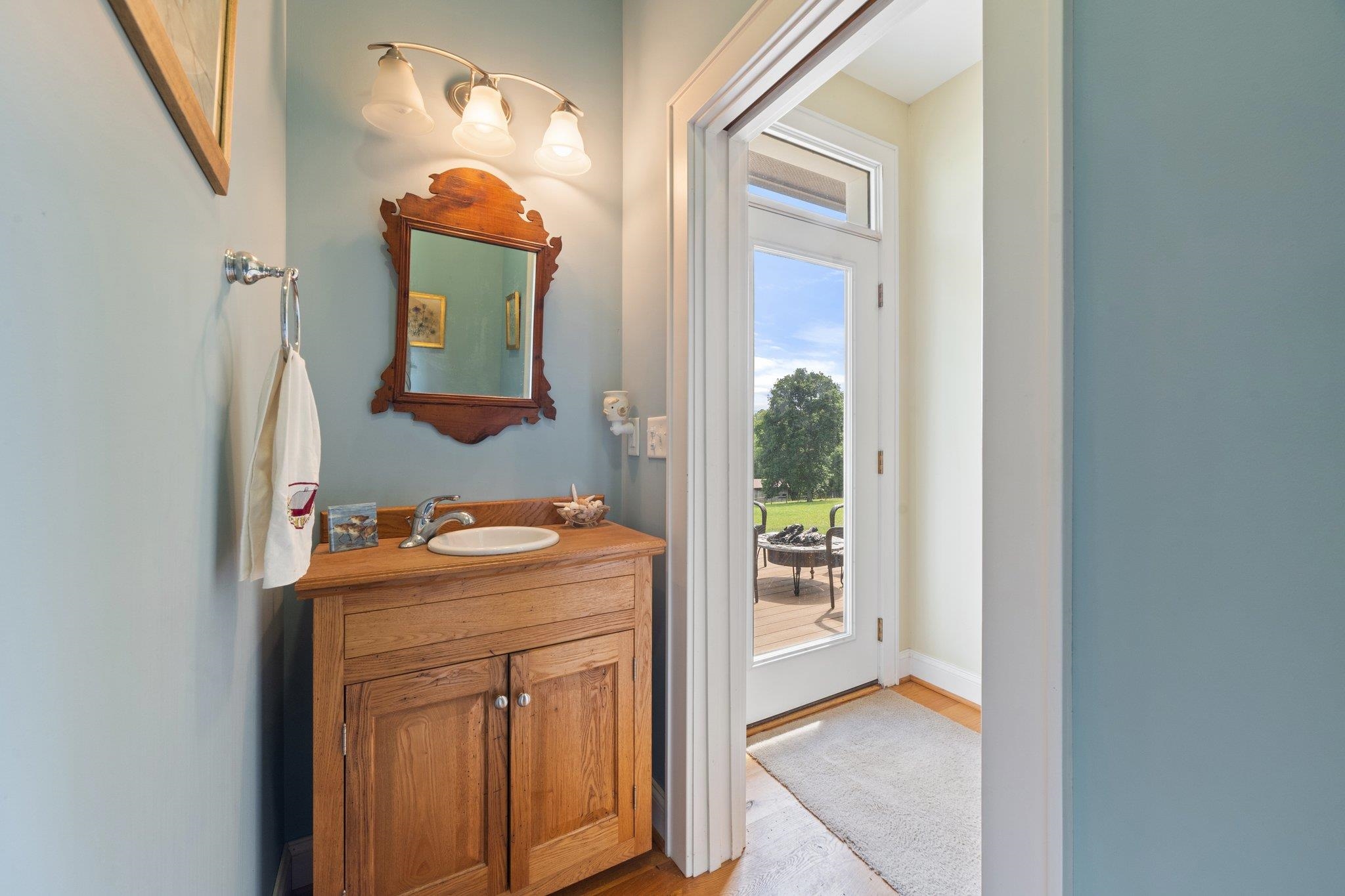 5237 Doe Hill Road McDowell, VA 24458 - Photo 40 of 75 a bathroom with a sink mirror and vanity