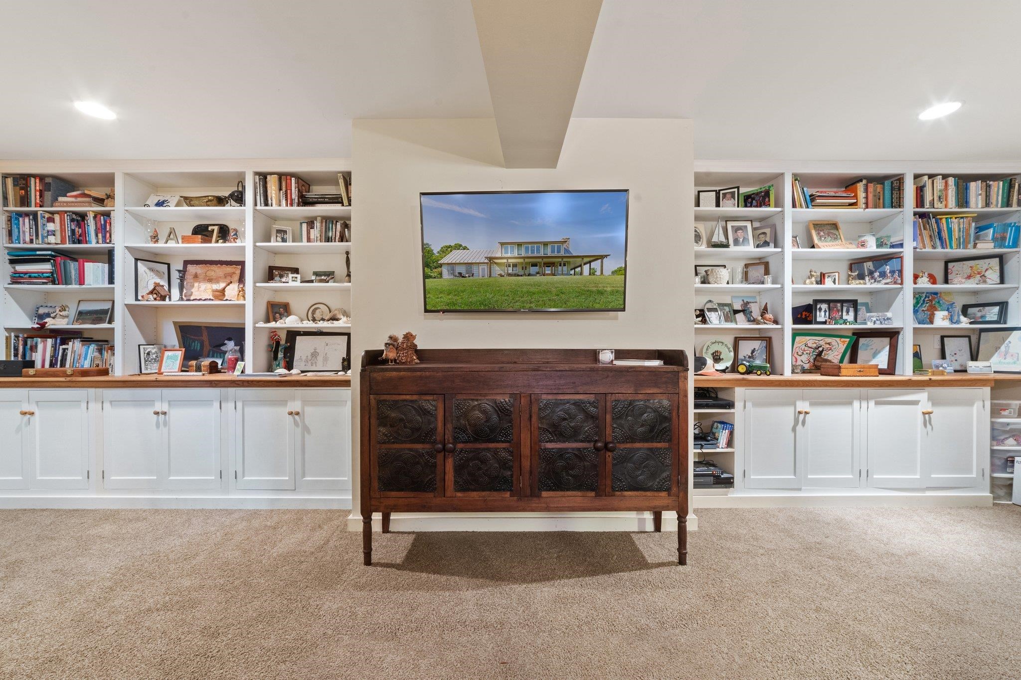 5237 Doe Hill Road McDowell, VA 24458 - Photo 63 of 75 a living room with a bookshelf and a large window