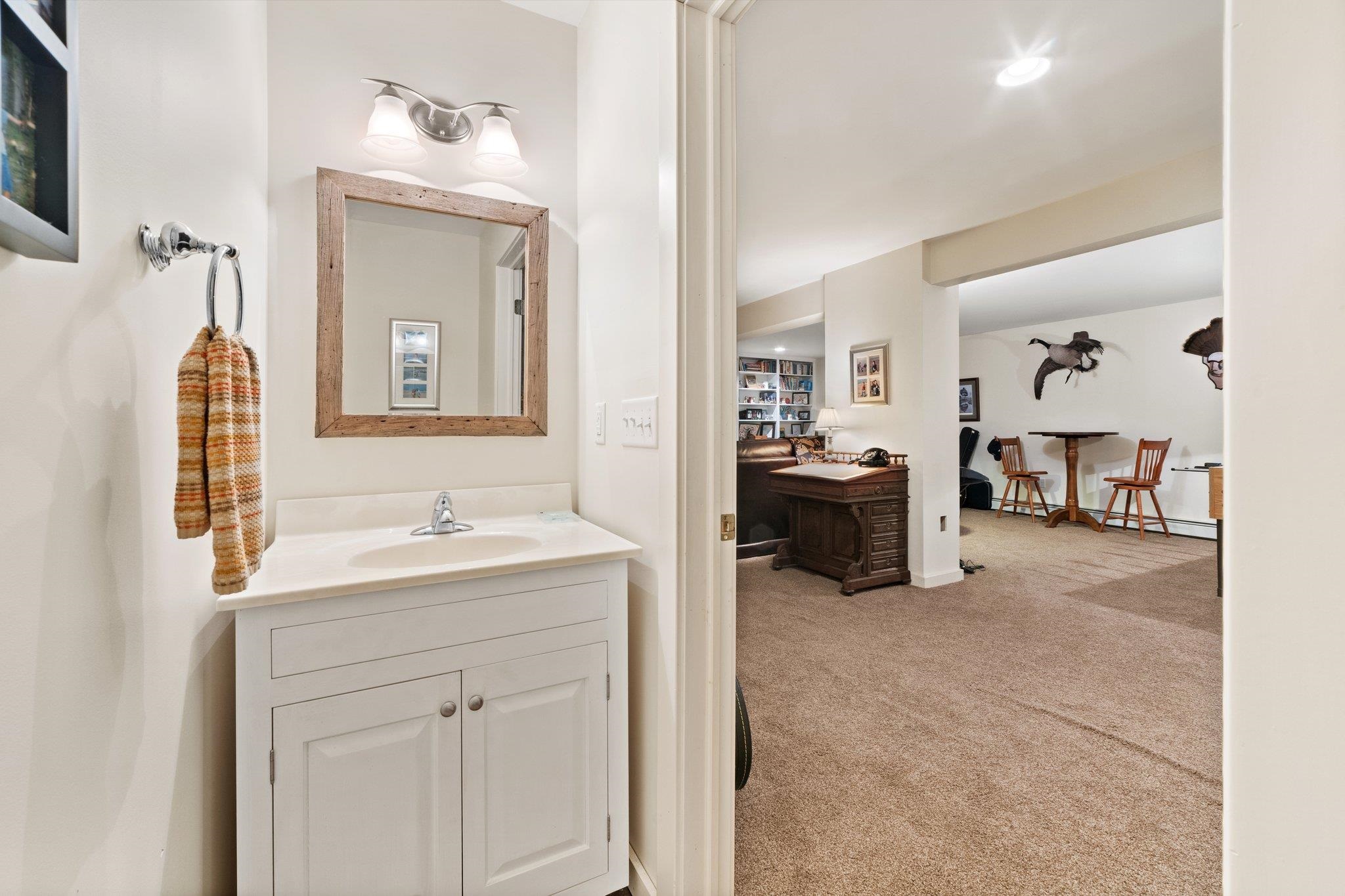 5237 Doe Hill Road McDowell, VA 24458 - Photo 65 of 75 a en suite bathroom with a double vanity sink and a mirror