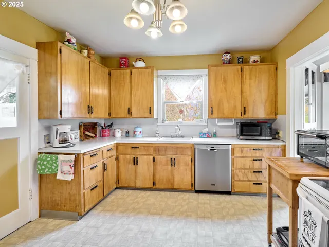 a large kitchen with a large window
