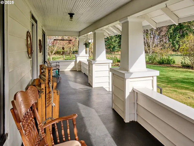 a view of living room with furniture and floor to ceiling window