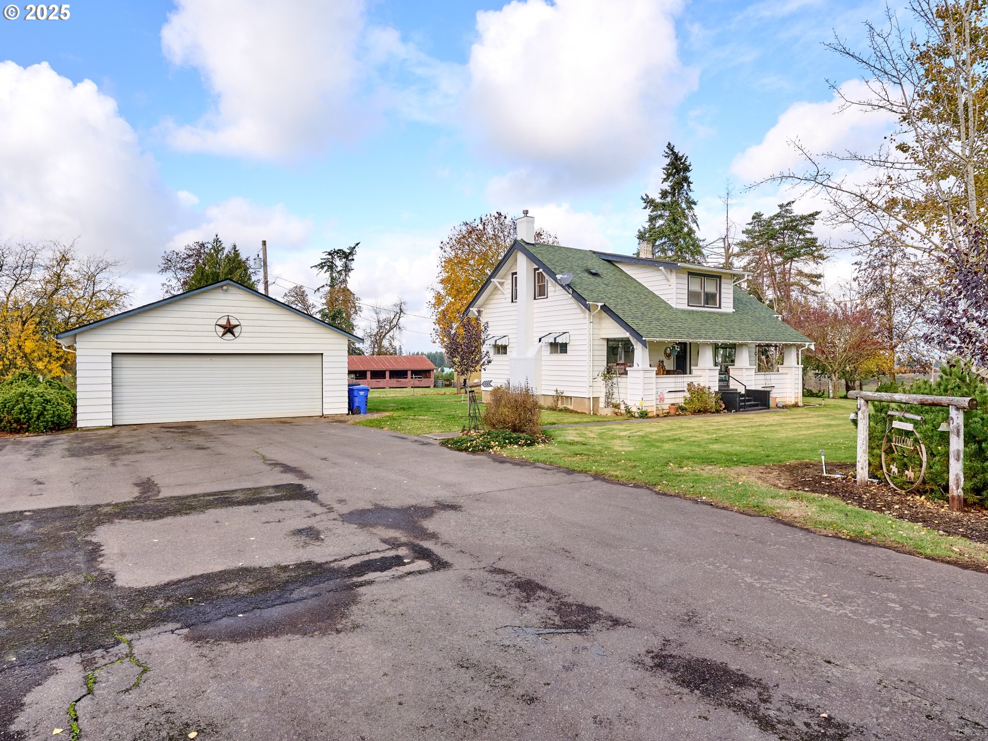 13595 South Warrick Road Molalla, OR 97038 - Photo 23 of 48 a front view of a house with a yard and garage