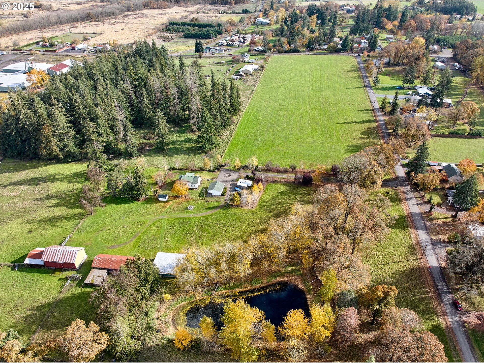 13595 South Warrick Road Molalla, OR 97038 - Photo 47 of 48 a view of a lake with a houses