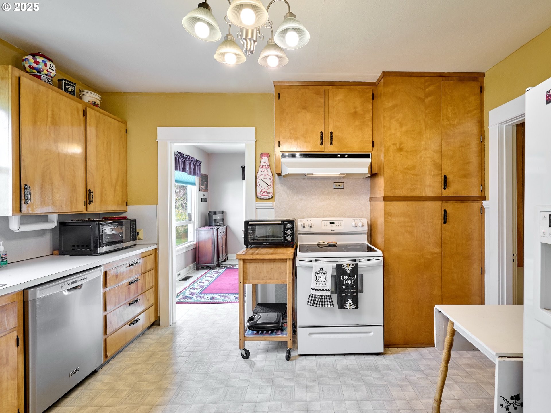13595 South Warrick Road Molalla, OR 97038 - Photo 10 of 48 a kitchen with cabinets and wooden floor