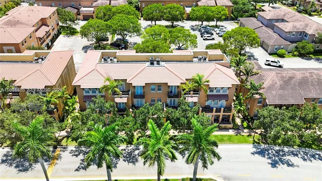 an aerial view of a house with yard swimming pool and outdoor seating