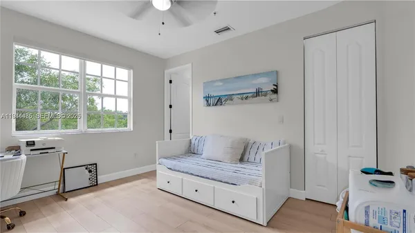 a living room with furniture and a window