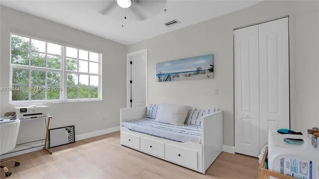 a living room with furniture and a window