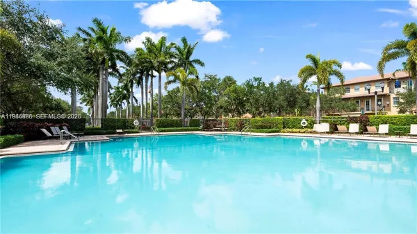 a view of a swimming pool with lounge chair
