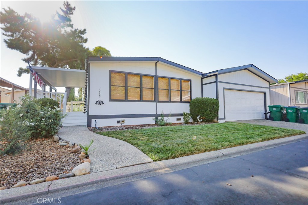3549 Vía Medio, Unit 178 Chico, CA 95973 - Photo 1 of 1 a view of a house with a yard and a large tree