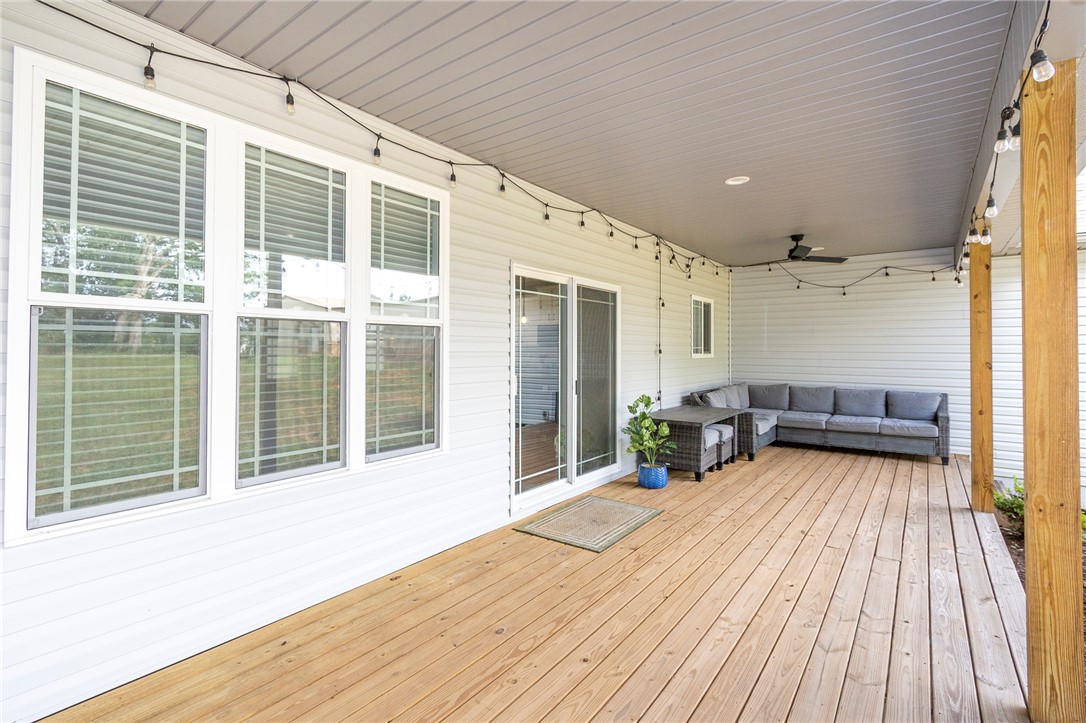 3080 McGee Road Iva, SC 29655 - Photo 37 of 49 An inviting covered patio featuring robust wood decking and ample space for comfortable outdoor living.
