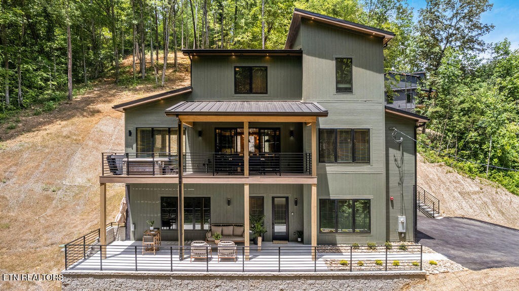 1620 Bear Valley Road Sevierville, TN 37876 - Photo 2 of 60 a view of a brick house with large windows