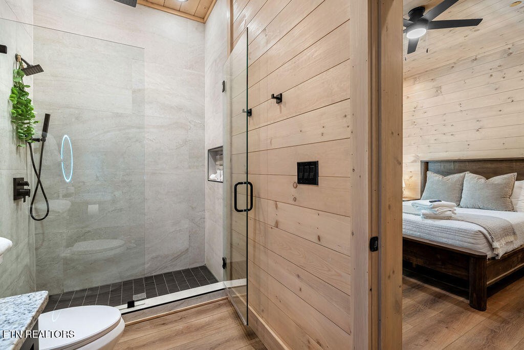 1620 Bear Valley Road Sevierville, TN 37876 - Photo 57 of 60 a bathroom with a shower and a toilet