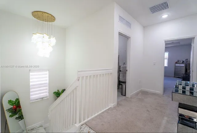 a bedroom with a bed dresser and window