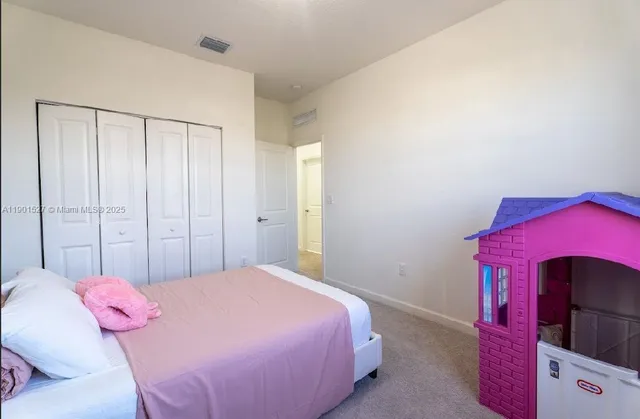 a bathroom with a granite countertop sink toilet a shower and a mirror