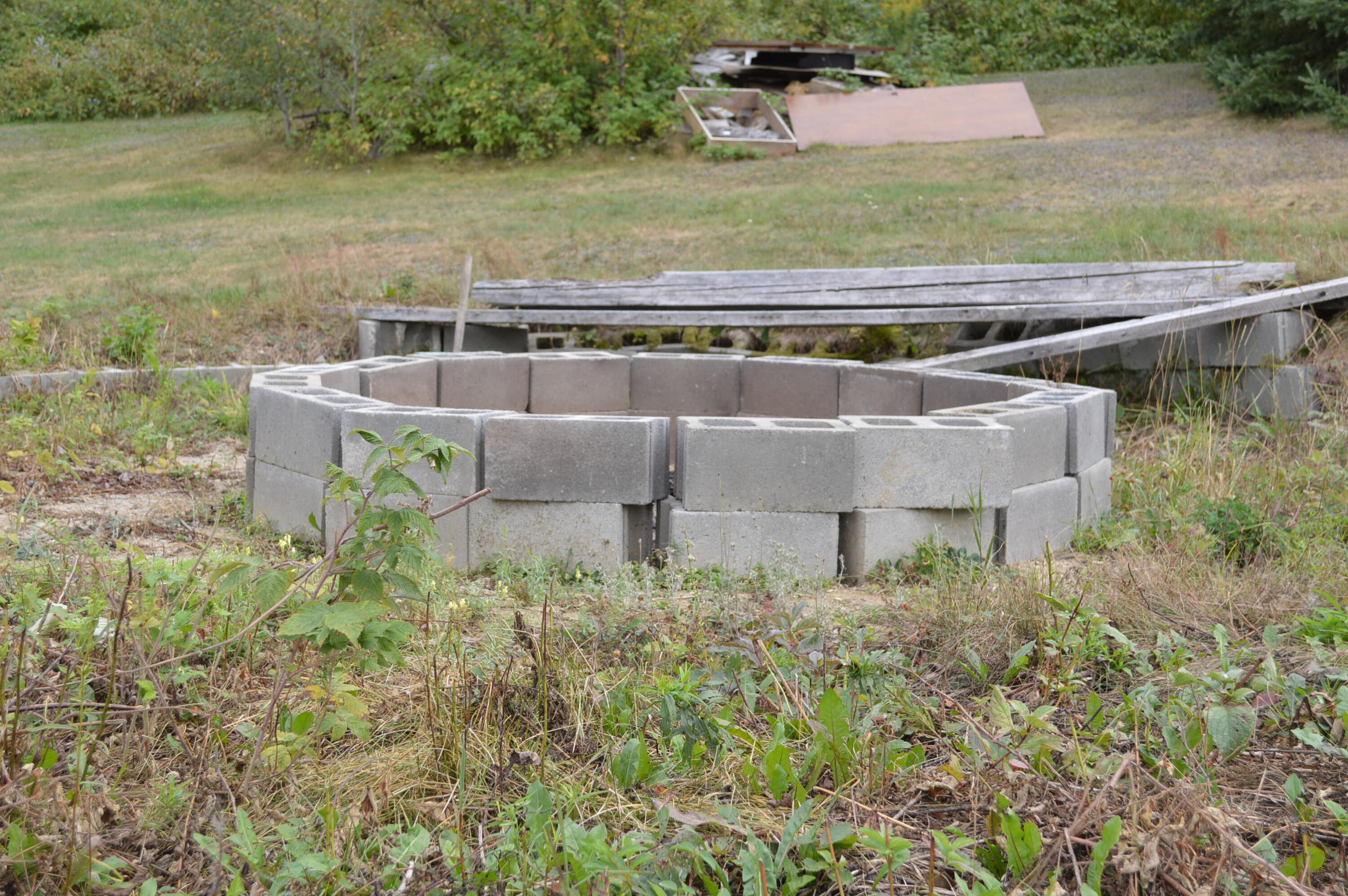 153 Pelletier Road Fort Kent, ME 04743 - Photo 12 of 36 Fire pit on flat spot where a pool can g
