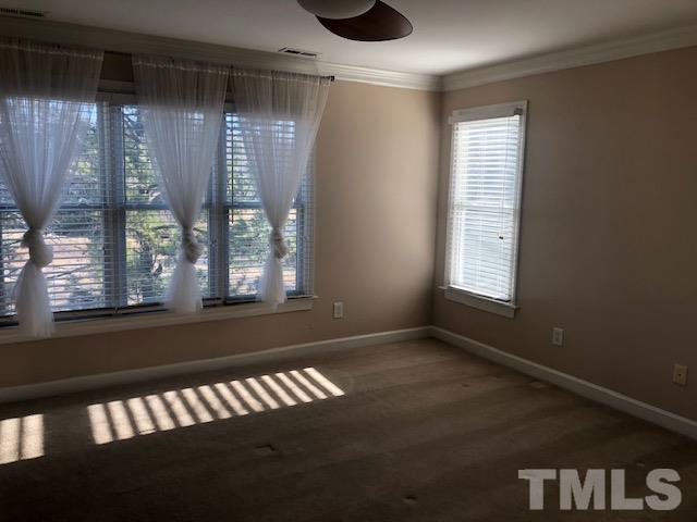 278 Waterville Street Raleigh, NC 27603 - Photo 4 of 7 a view of wooden floor and windows in a room