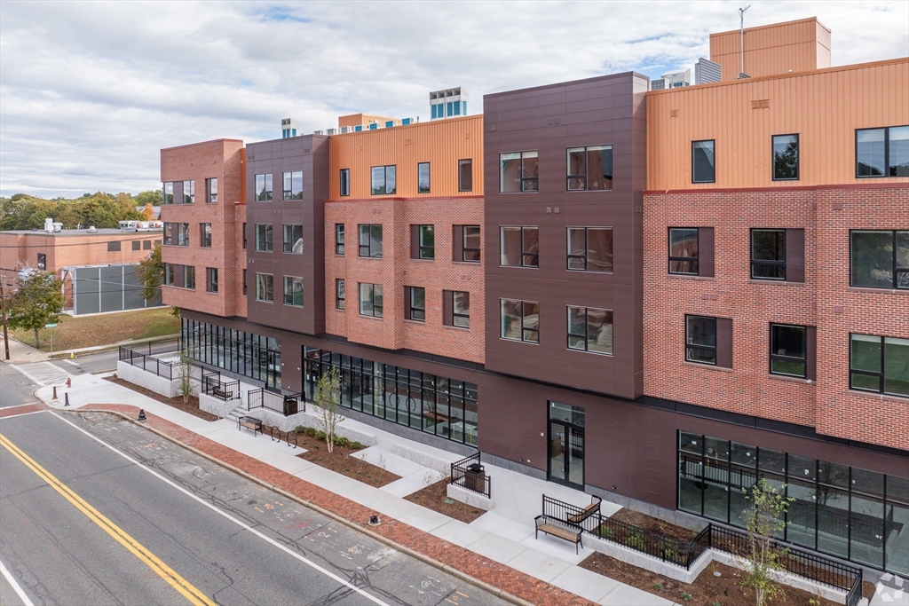 45 East Central Street, Unit 401 Natick, MA 01760 - Photo 11 of 16 a city view with tall buildings