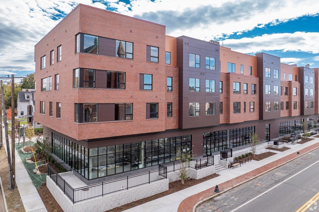 45 East Central Street, Unit 401 Natick, MA 01760 - Photo 15 of 16 a view of a building with many windows