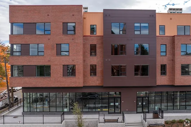 a front view of a building with glass windows