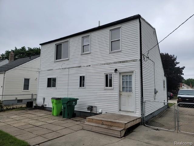 21828 Rausch Avenue Eastpointe, MI 48021 - Photo 2 of 15 Two-story residence featuring white horizontal siding, a dark roofline, and multiple windows