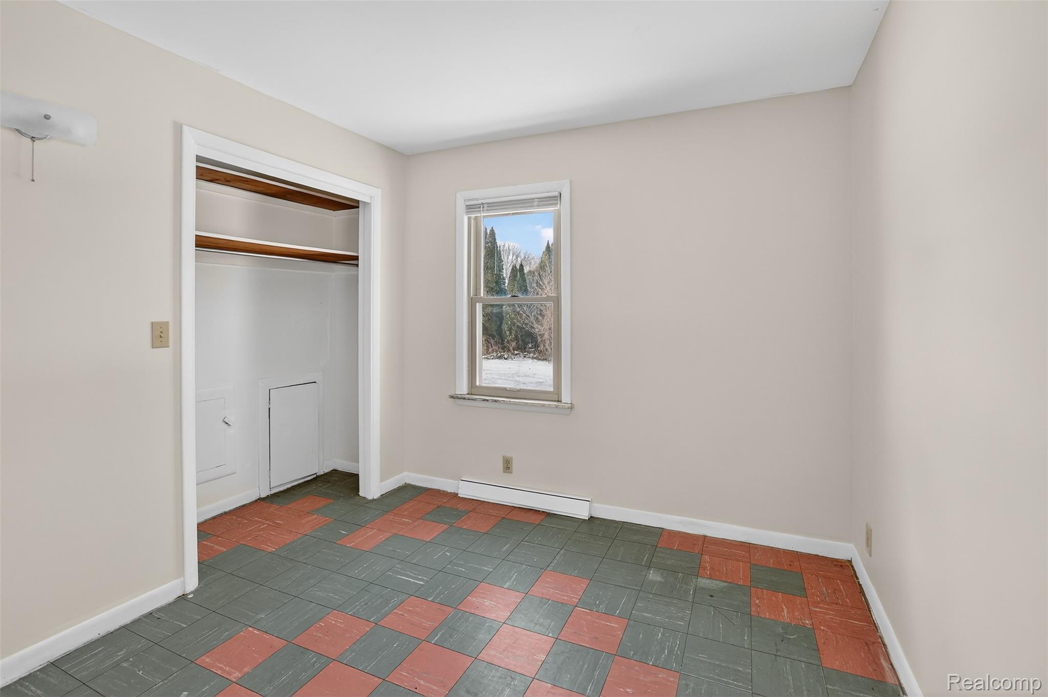 3241 Curtis Road Birch Run, MI 48415 - Photo 22 of 47 Unfurnished bedroom featuring a baseboard radiator and a closet