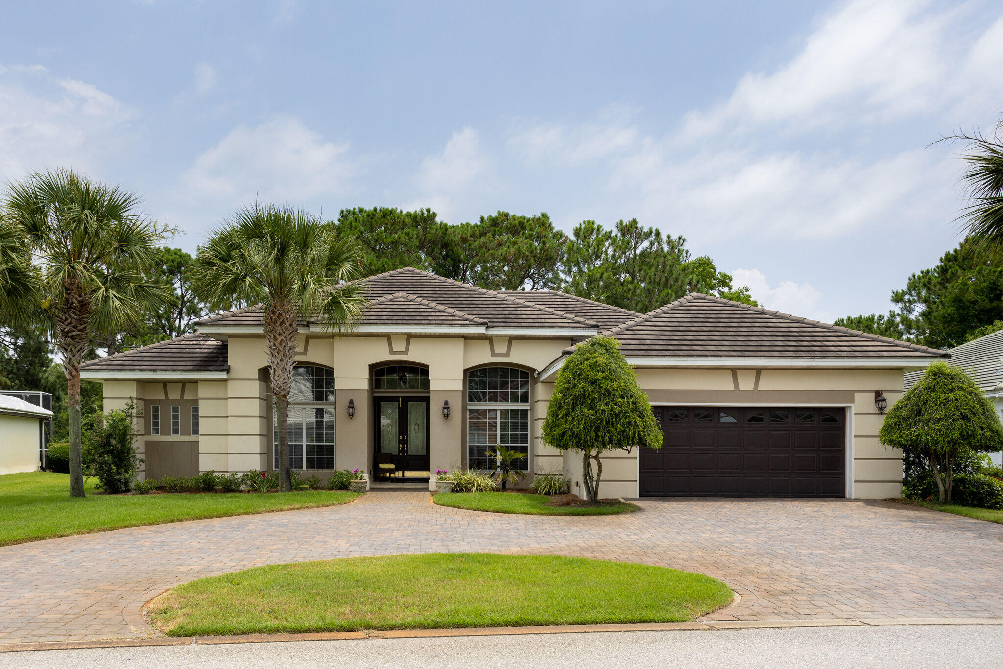 740 Indigo Loop Miramar Beach, FL 32550 - Photo 1 of 39 a front view of a house with a garden and yard
