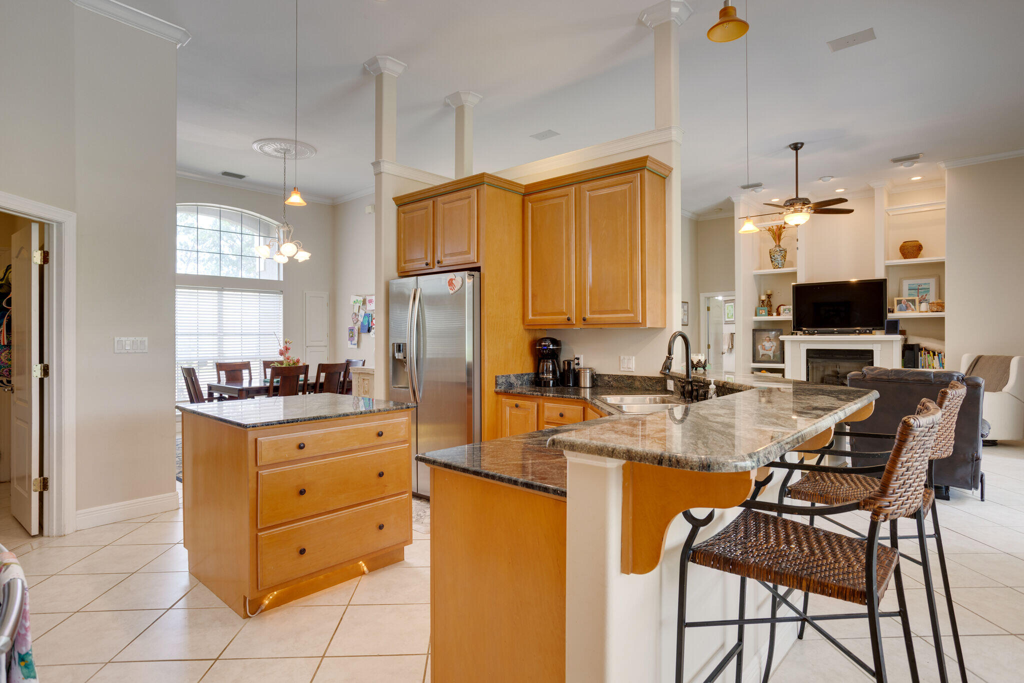740 Indigo Loop Miramar Beach, FL 32550 - Photo 11 of 39 a kitchen with kitchen island granite countertop a stove oven and a refrigerator