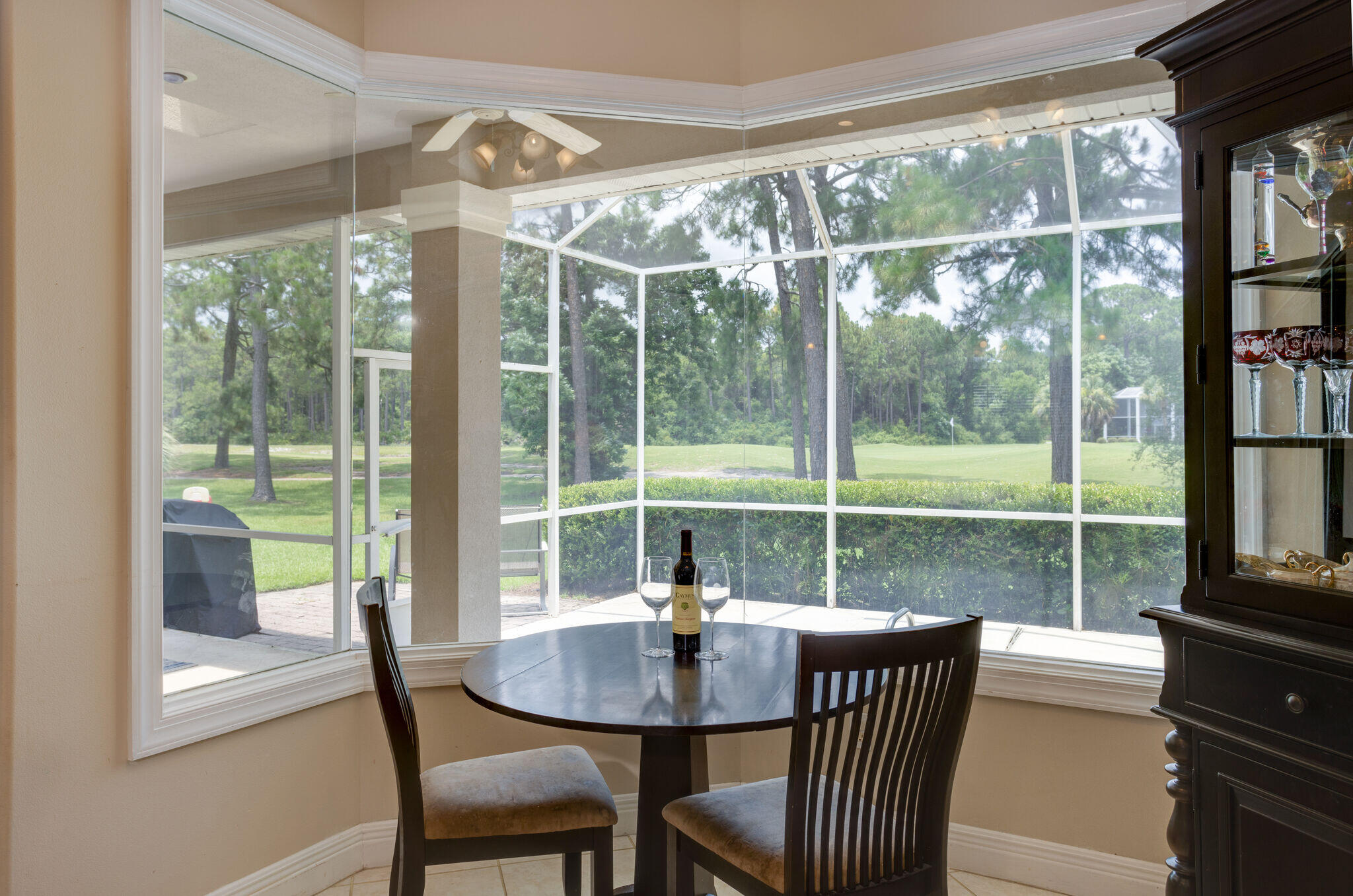 740 Indigo Loop Miramar Beach, FL 32550 - Photo 12 of 39 a view of a dining room with furniture large windows and wooden floor