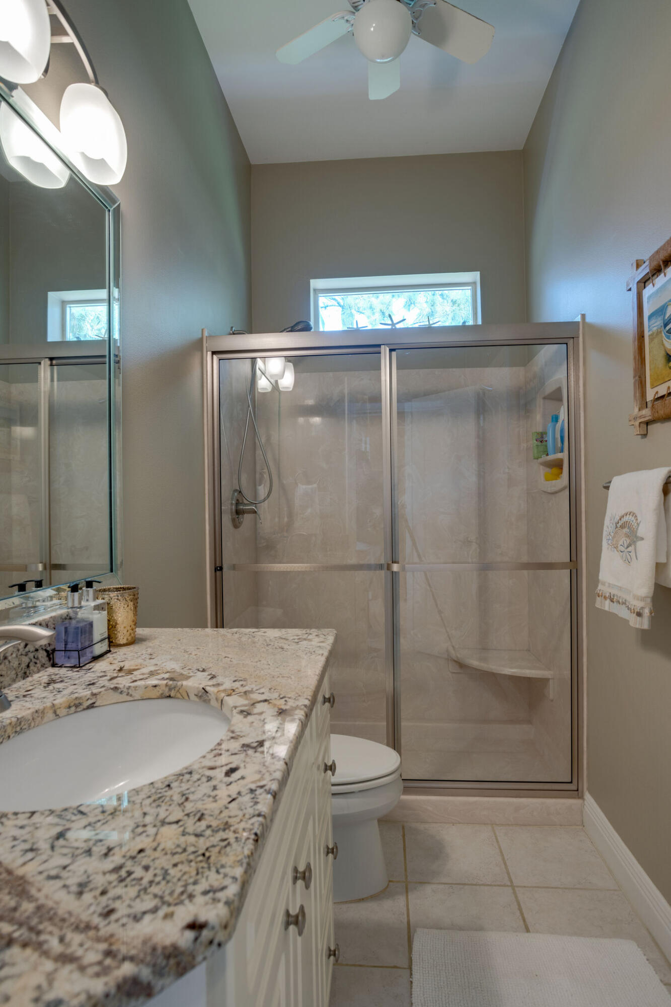 740 Indigo Loop Miramar Beach, FL 32550 - Photo 14 of 39 a bathroom with a granite countertop sink a toilet and shower
