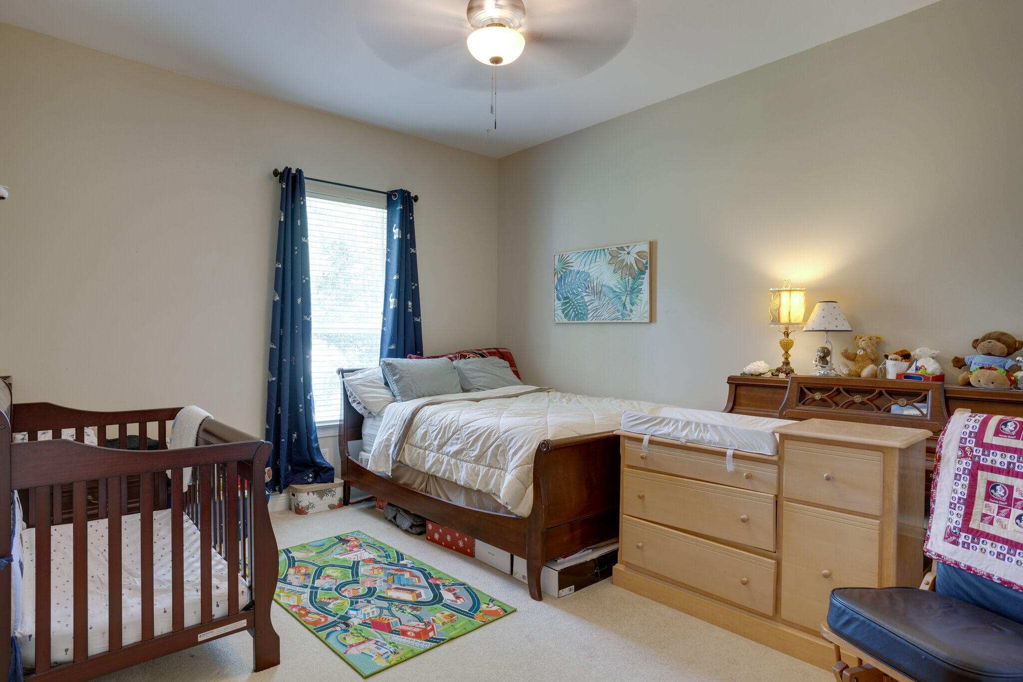 740 Indigo Loop Miramar Beach, FL 32550 - Photo 15 of 39 a bedroom with a bed and a chandelier