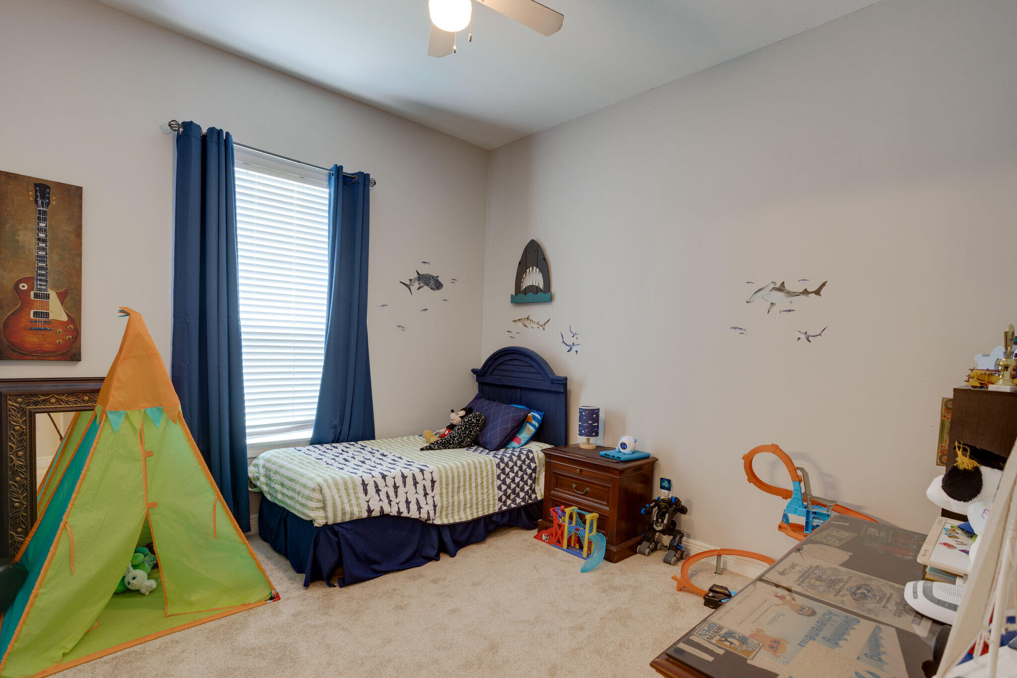 740 Indigo Loop Miramar Beach, FL 32550 - Photo 16 of 39 a bedroom with a bed and a chandelier