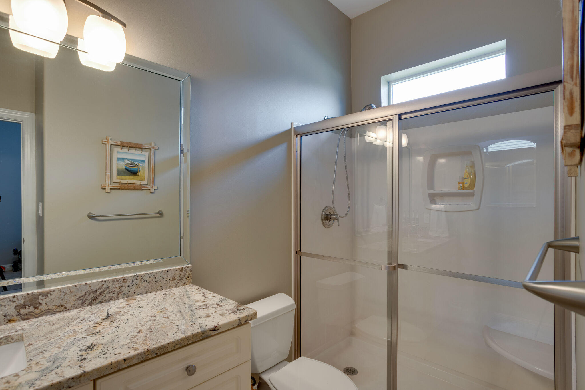 740 Indigo Loop Miramar Beach, FL 32550 - Photo 17 of 39 a bathroom with a granite countertop sink toilet and shower