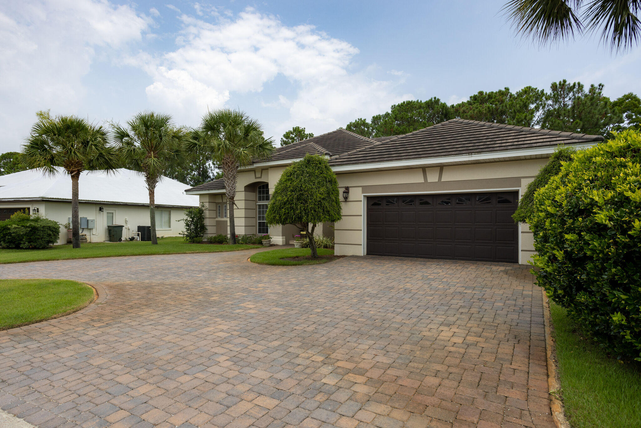 740 Indigo Loop Miramar Beach, FL 32550 - Photo 2 of 39 a front view of a house with a yard and garage