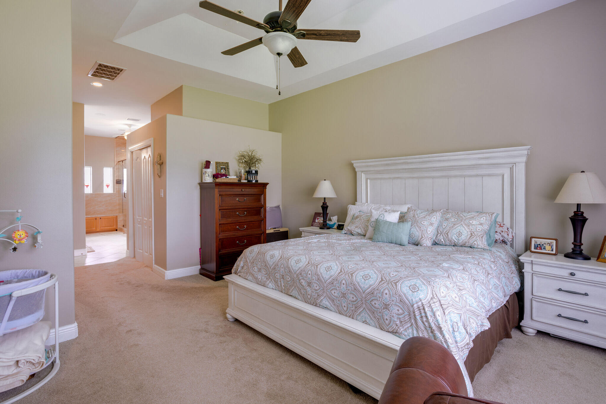 740 Indigo Loop Miramar Beach, FL 32550 - Photo 26 of 39 a spacious bedroom with a bed and a walk in closet