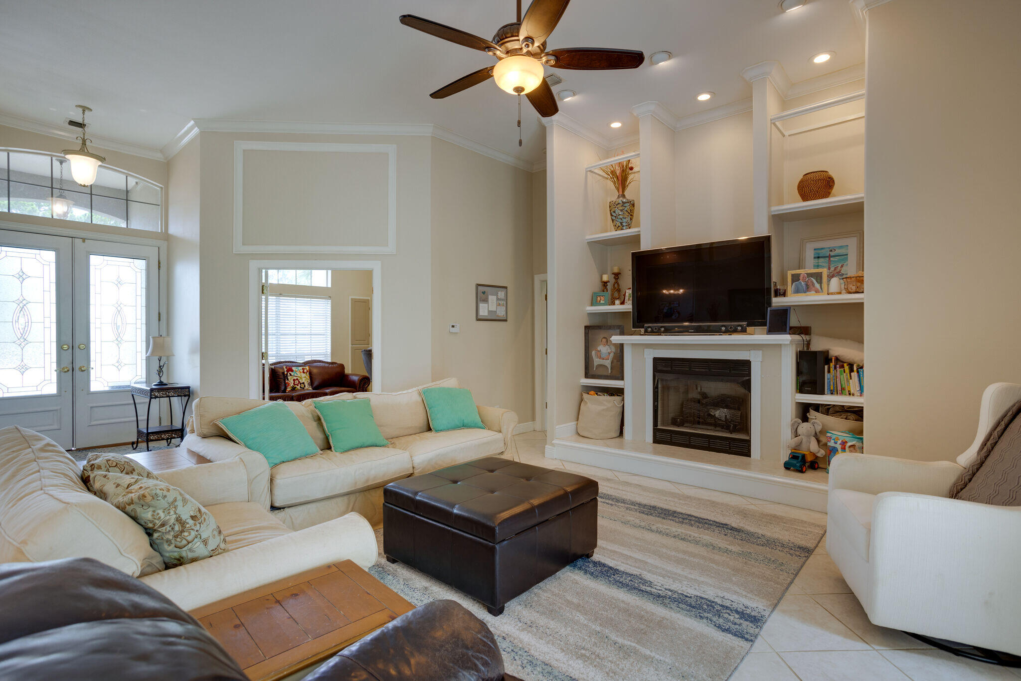 740 Indigo Loop Miramar Beach, FL 32550 - Photo 29 of 39 a living room with furniture a fireplace and a flat screen tv