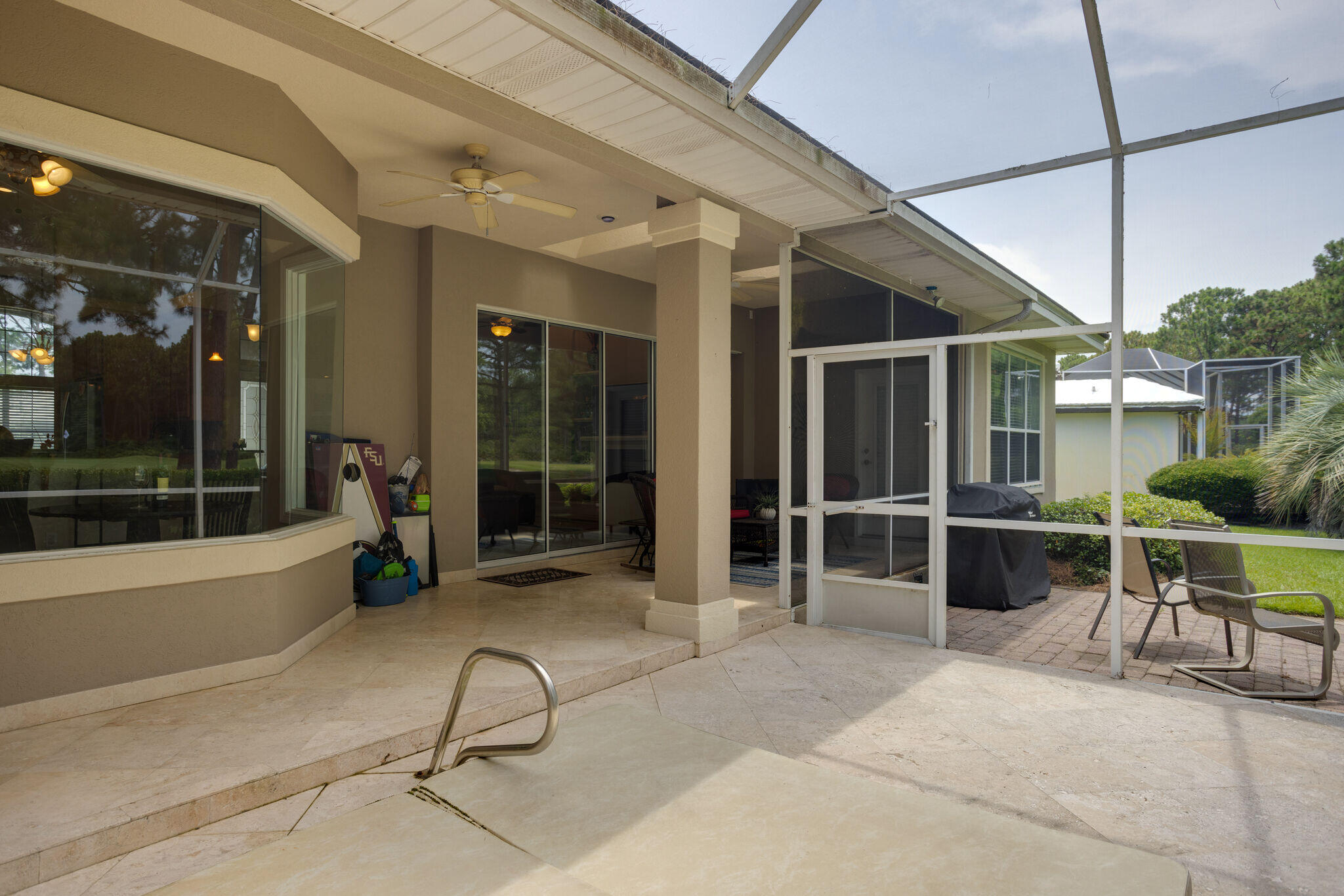 740 Indigo Loop Miramar Beach, FL 32550 - Photo 31 of 39 a view of a patio with table and chairs and potted plants
