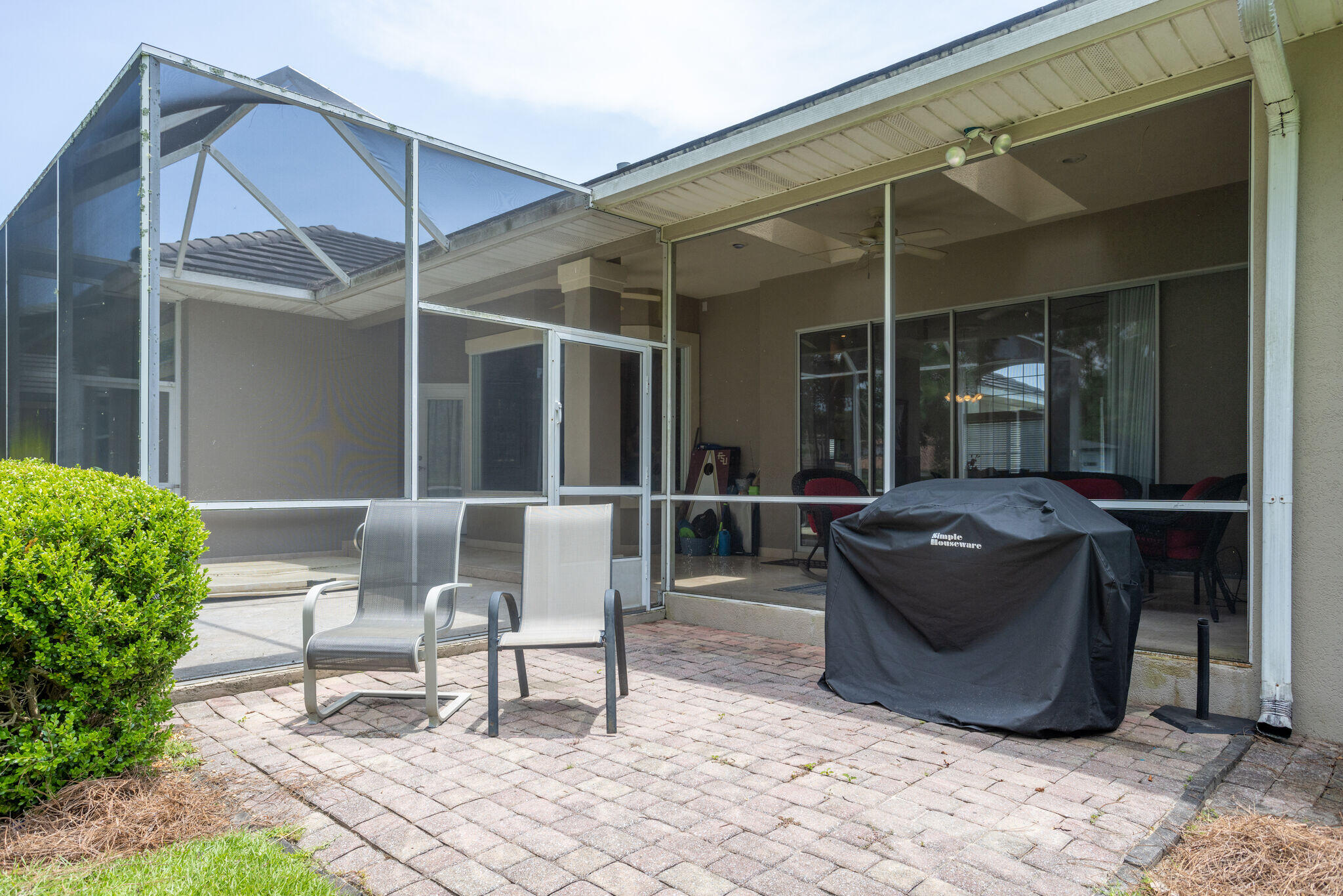 740 Indigo Loop Miramar Beach, FL 32550 - Photo 32 of 39 a view of a patio with table and chairs and potted plants