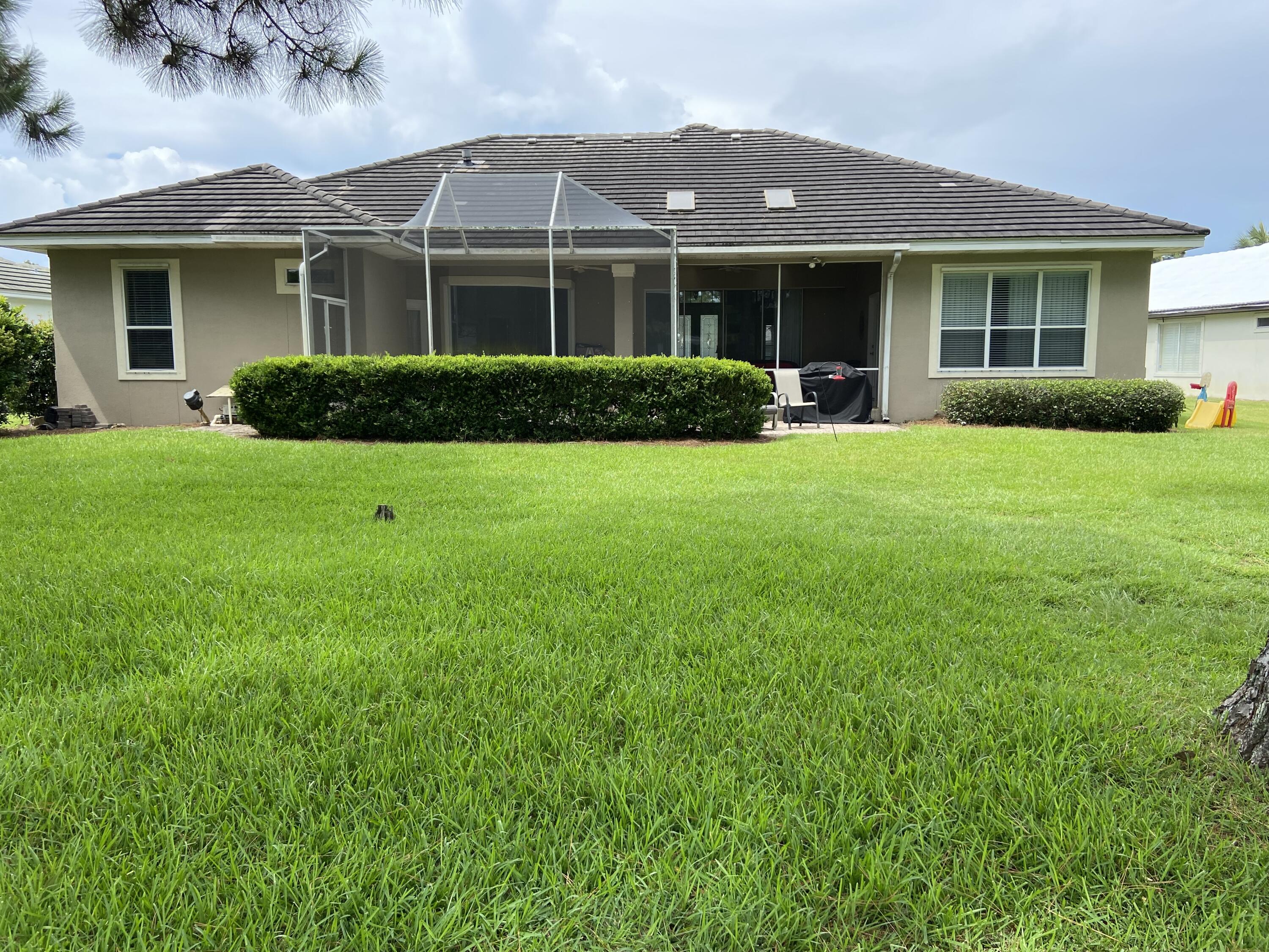 740 Indigo Loop Miramar Beach, FL 32550 - Photo 36 of 39 a front view of a house with a garden