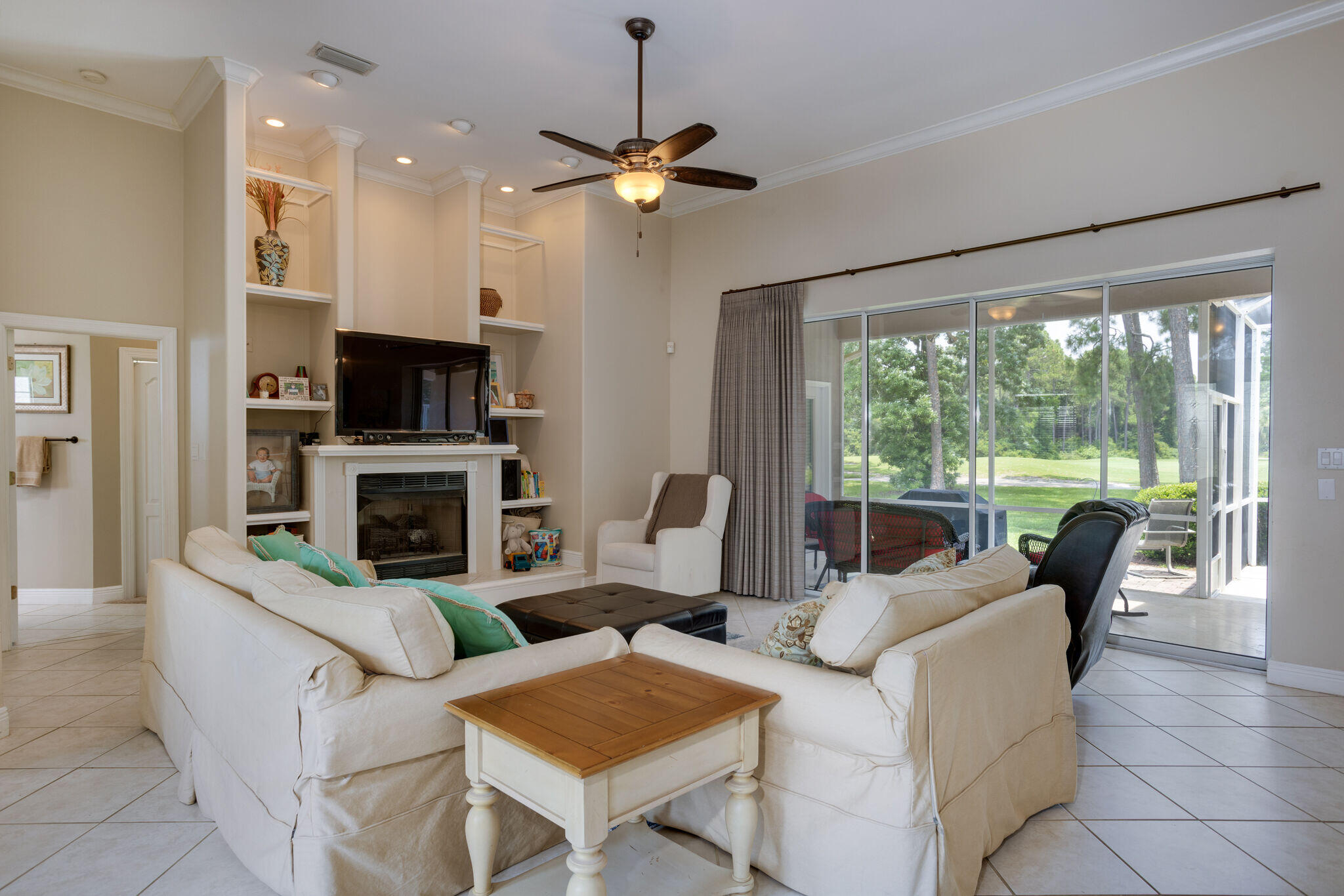740 Indigo Loop Miramar Beach, FL 32550 - Photo 5 of 39 a living room with furniture a fireplace and a flat screen tv