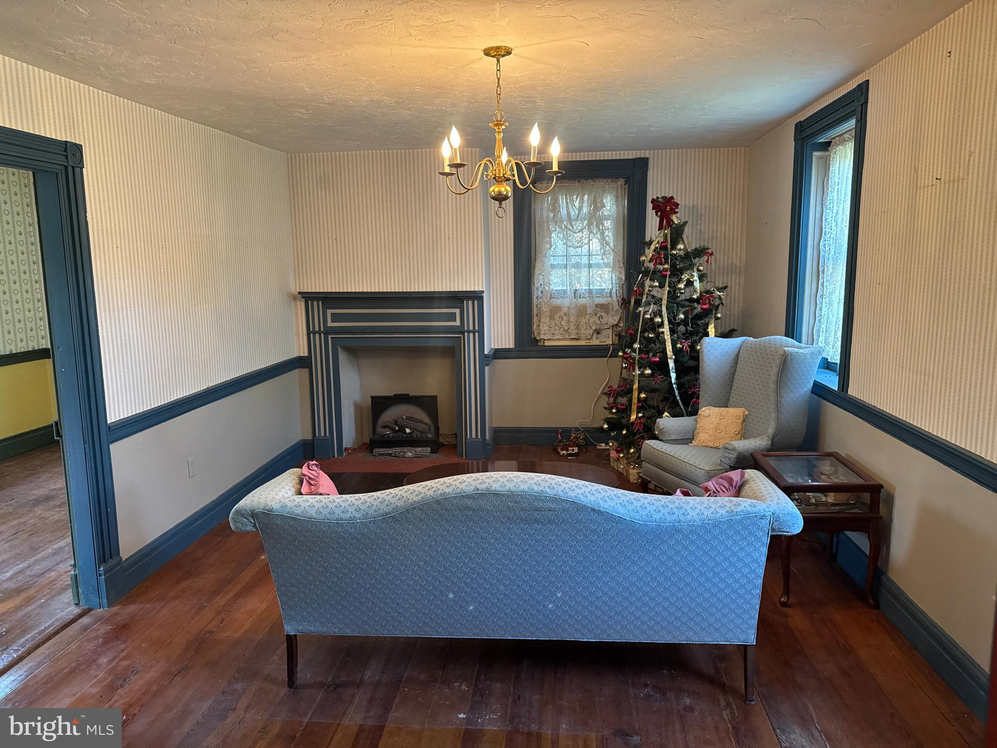 240 Cavalry Field Road Gettysburg, PA 17325 - Photo 56 of 121 a living room with furniture wooden floor and a chandelier