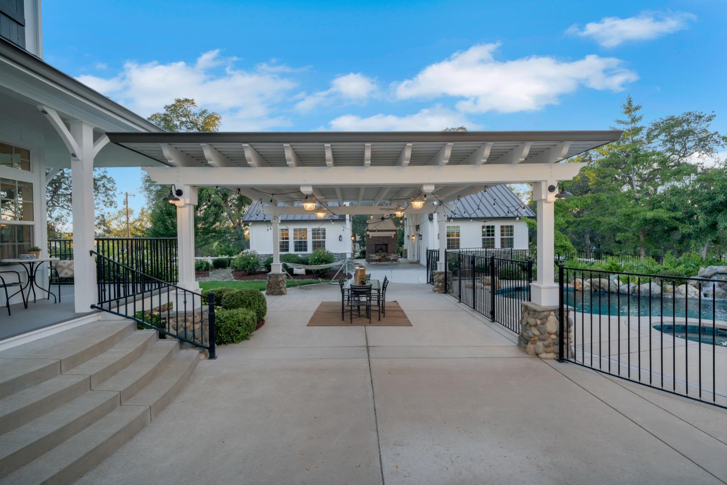 2905 Virginiatown Road Lincoln, CA 95648 - Photo 41 of 86 Concrete patio featuring a white pergola with recessed lighting and fans