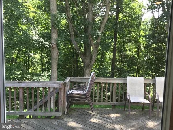 a view of a chair and table in the balcony