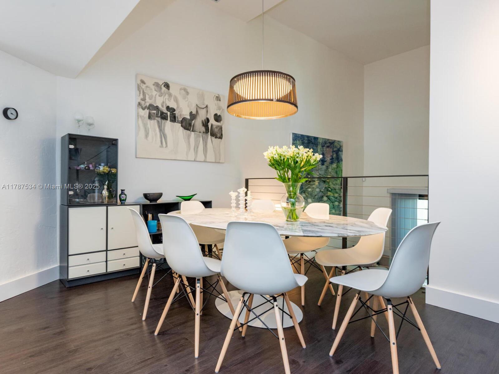 3229 Mary Street, Unit 2 Miami, FL 33133 - Photo 18 of 56 a view of a dining room with furniture and wooden floor